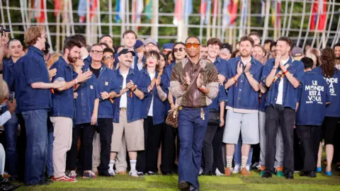 Reuters Pharrell Williams walks the Louis Vuitton PFW runway