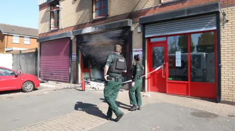 Pacemaker Police at the scene of the attack on the Welcome Organisation