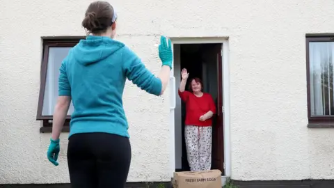 PAcemaker A volunteer delivers a food box to a lady in County Antrim
