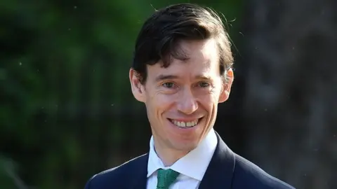 Getty Images The former Cabinet Minster said he could not ask his unpaid volunteers to continue for another year.