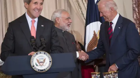 Getty Images Indian Prime Minister Narendra Modi shakes hands with US Vice-President Joe Biden