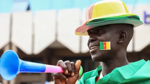 AFP A vendor of football attire in Yaoundé, Cameroon - Wednesday 5 January 2022