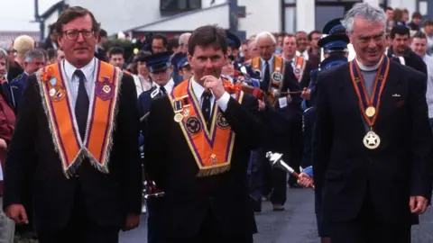 Pacemaker PACEMAKER, BELFAST, 23/3/2000: Ulster Unionist leader David Trimble at Drumcree in 1996 with Jeffry Donaldson (centre) and Rev. Martin Smyth