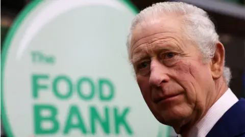 Getty Images King Charles III visits the Milton Keynes food bank on February 16, 2023 in Milton Keynes, England