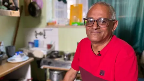 Kyla Herrmannsen/BBC Man looking at the camera