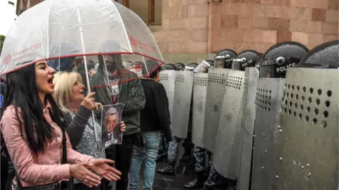 AFP Protesters confront police in Yerevan, 19 April