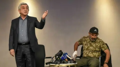 AFP Prime Minister Serzh Sargsyan walks out of a televised meeting with Nikol Pashinyan, 22 April