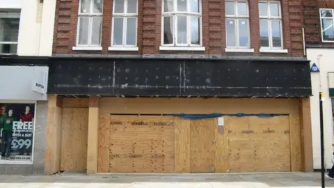 Boarded-up shop