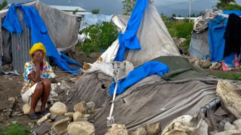 Reuters A woman in Haiti in 2012 (file picture)