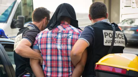 AFP Suspect arrives at Marseille courthouse, 27 Jun 14