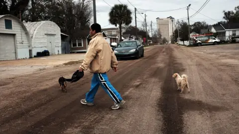 Getty Images Man crossing street in Biloxi, Mississippi