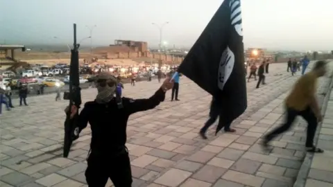 Reuters An IS fighter in Mosul (June 2014)
