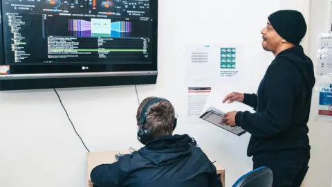 LEE BROWN Student being taught in music production