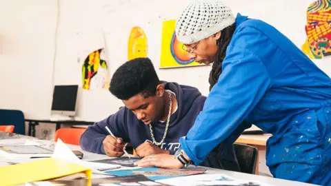 LEE BROWN Tutor teaching student