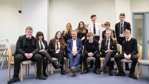 Allan Little with pupils at Stranraer Academy