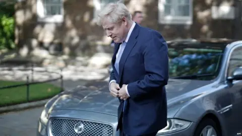 AFP Boris Johnson arriving in Downing Street as prime minister for the first time