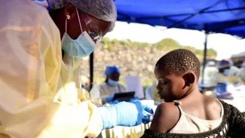 Reuters Health personnel administering the Ebola vaccine in Goma