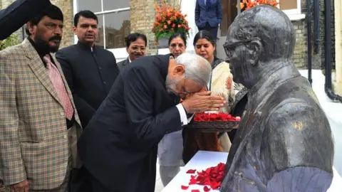 Ambedkar House Indian Prime Minister Narendra Modi bowing by a bust of Dr Ambedkar