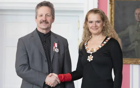 Johanie Maheu Jim Estill receiving the Order of Canada from the Governor General Julie Payette