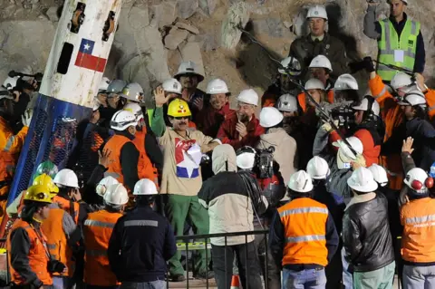 Getty Images Chilean miner Juan Illanes celebrates after coming out of the Phoenix capsule, which brought him to the surface on 13 October 2010