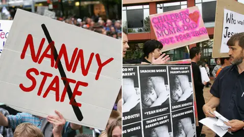 Getty Images Protestors and banners for and against the NZ smacking ban