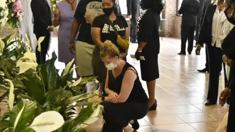 EPA People pay their respects to George Floyd before a memorial service in Raeford, North Carolina (6 June 2020)