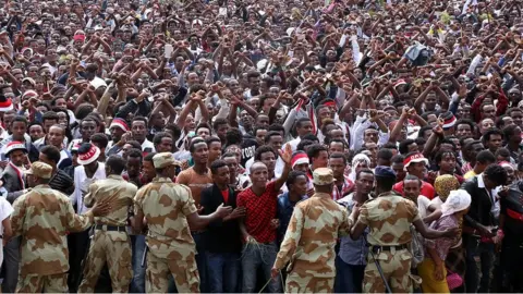 Getty Images Security measures are taken as the Oromo people stage a protest against government during the Oromo new year holiday Irreechaa' near the Hora Lake at Dberzit town in Addis Ababa, Ethiophia on October 02, 2016.