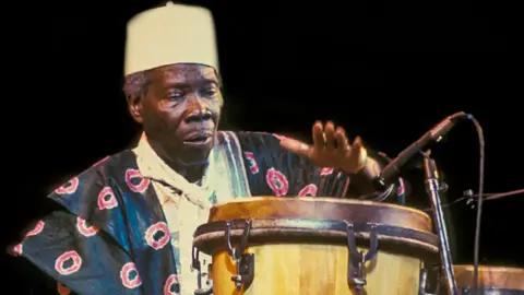 Getty Images Babatunde Olatunji at a Lincoln Center Out Of Doors concert in Damrosch Park in New York, the US - August 1997