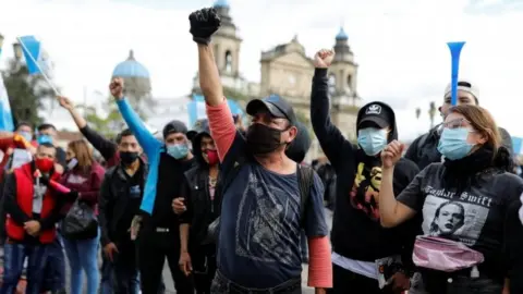 Reuters Demonstrators shout slogans during a protest to demand the resignation of President Alejandro Giammattei in Guatemala City, Guatemala November 22, 202