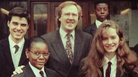 PA Media Philip Lawrence and school pupils