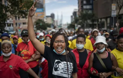 AFP Students members of the African National Congress (ANC) and the Economic Freedom Fighters (EFF) march chanting slogans during a protest in Braamfontein, Johannesburg, South Africa - Wednesday 10 March 2021
