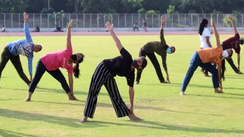 Hindustan Times People performing yoga during a preparation of the 7th International Yoga Day at Tau Devi Lal Stadium Sector-38 near Rajiv Chowk, on June 19, 2021 in Gurugram, India.