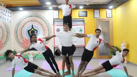 Hindustan Times Youth performing yoga on the eve of International Yoga Day, on June 20, 2021 in Amritsar, India. The theme of this year's Yoga Day is Yoga for wellness, which focuses on practising Yoga for both physical and mental well being.