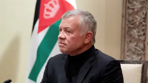 Reuters Jordan's King Abdullah II listens during a meeting in Amman, Jordan, May 26, 2021