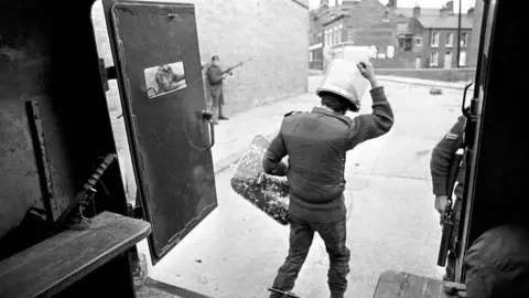 Getty Images/Mirrorpix Photo taken from inside an Army vehicle during a patrol of Belfast in 1971