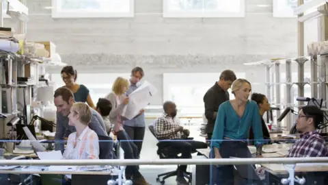 Getty Images A busy office scene