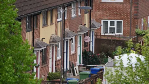 PA Media Photo of the houses on the street where it happened
