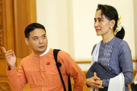 Reuters National League for Democracy party (NLD) leader Aung San Suu Kyi and Member of Parliament Thaw leave after attending a lower house of parliament meeting at Naypyitaw
