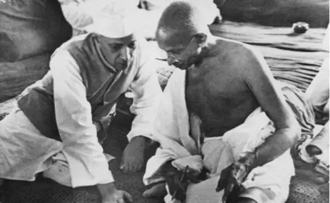 Getty Images Jawaharlal Nehru and Mahatma Gandhi at the 1942 Congress session at which the Quit India Resolution was passed, calling for India's independence from British rule