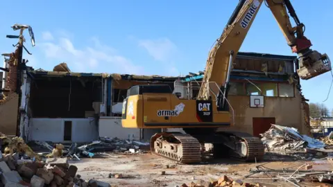 Forest of Dean District Council Machinery on the demolition site