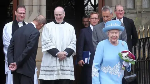 PETER MUHLY/GETTY IMAGES Queen Elizabeth II walked from a Protestant church to a Catholic Church in Enniskillen in 2012