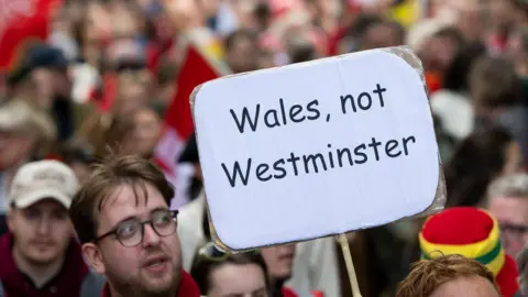 Getty Images man holding sign at march