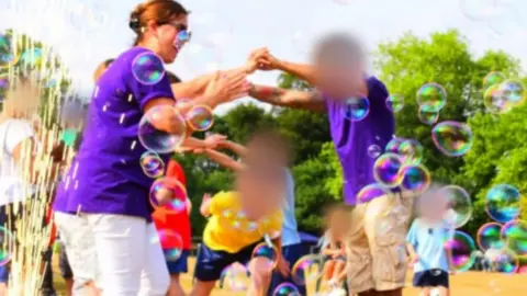 Submitted Carol Mitchell, seen here playing with pupils, did not provide a statement or answers to questions