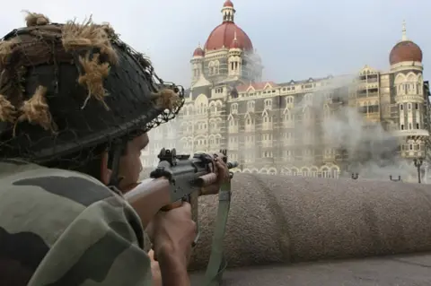 AFP An Indian army soldier holds positions outside The Taj Mahal hotel in Mumbai on November 29, 2008. Indian commandos have killed the last Islamic militants holed up inside Mumbai's Taj Mahal hotel, ending the more than two-day assault on India's financial capital, the city's police chief told AFP.
