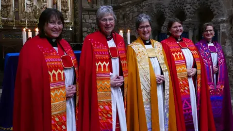 Peter Collet r-l Revd Julia Bradshaw (Curate); Revd Canon Alison Adams (Canon Pastor); Revd Canon Karen Rooms (Acting Dean and also a Residentiary Canon of the Cathedral); Revd Canon Emma Davies (Canon Precentor); and Revd Manuela Schmucki (Curate).
