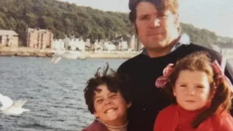 Monica Higgins Brian Higgins with his daughters, Monica and Noelle