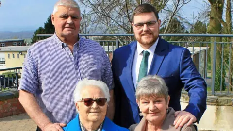 John Trainor John Trainor, mother Anne (previously a councillor in the Old Down District Council 1999-2005), Father John, grandmother Ann Quinn (husband was Sean L Quinn former Councillor in Down District Council).
