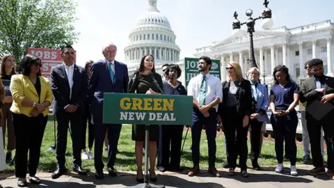 Getty Images Alexandria Ocasio-Cortez and other participants in a news conference on the Green New Deal