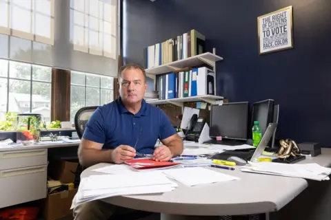 Scott Morgan David Whipple in his office in Indianola