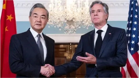Getty Images US Secretary of State Antony Blinken shakes hands with Chinese Foreign Minister Wang Yi prior to meetings at the State Department in Washington, DC, October 26, 2023.